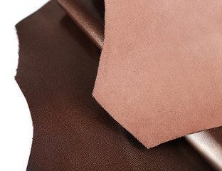 Dark brown leather on white background, close up