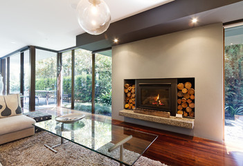 Blazing fire in luxury architect designed Australian house