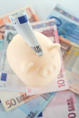 Piggy bank with money closeup