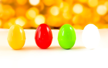 fancy or colorful of egg in yellow bokeh light background. soft focus