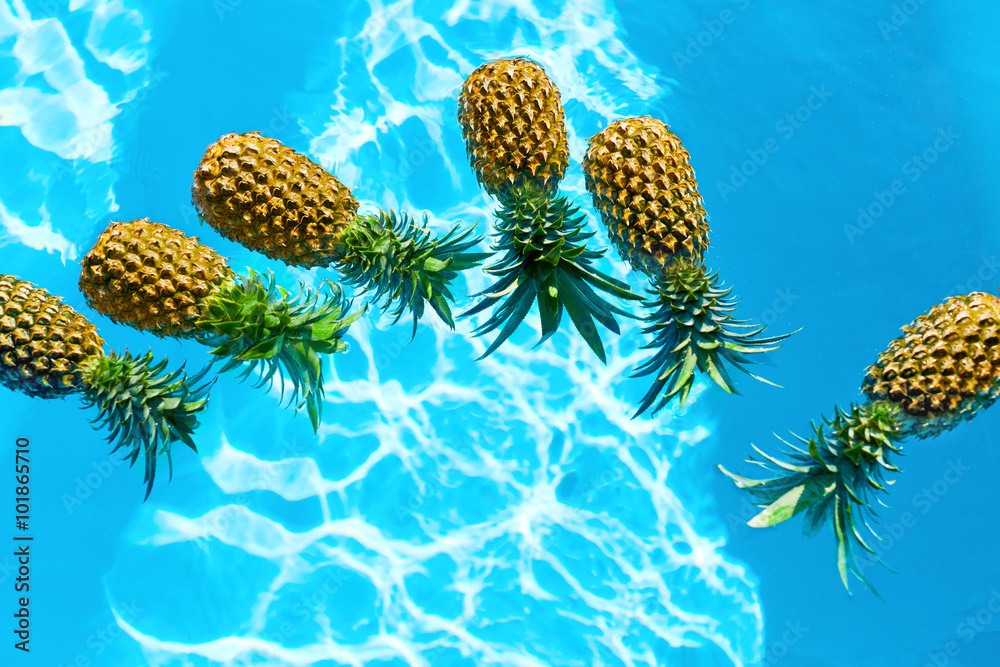 Wall mural Healthy Diet Food. Fresh Raw Organic Ripe Pineapples Floating In Pure Water In Swimming Pool. Juicy Fruits. Nutrition And Lifestyle. Eating Vitamins For Beauty And Health. Go Vegan, Hydration Concept