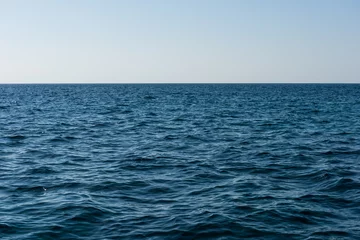 Foto op Plexiglas blue sea and sky background © yotrakbutda