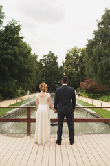 Fototapeta premium the bride and groom are holding each other