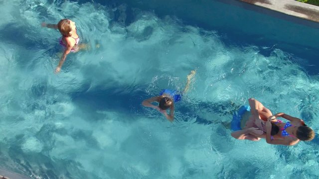 Aerial view of family enjoying pool time