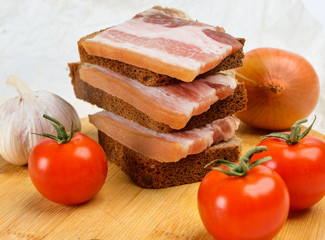 Of salted bacon sandwiches on rye bread.