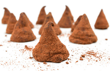 chocolate truffle candies on white background