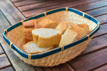 Slices of white bread in a wicker basket.