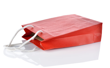 empty paper bag with shadow on white background