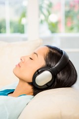 Relaxed brunette with headphones