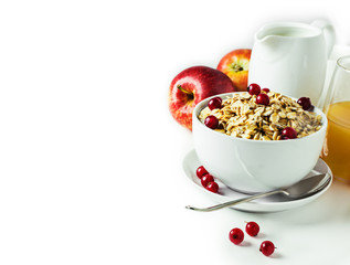 Breakfast with granola and fresh berries on white. Selective focus. Background layout with free text space.