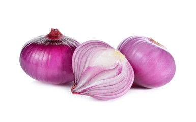whole and half cut red onion, shallots on white background
