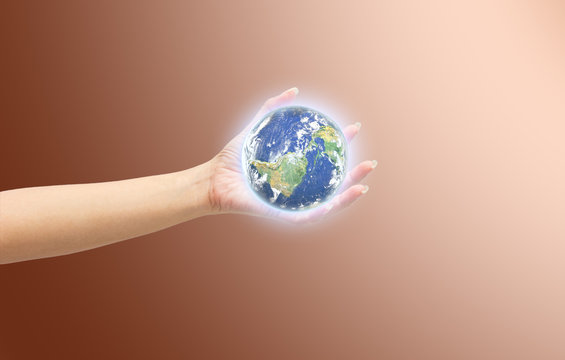 Human hand holding Earth planet. Elements of this image are furn