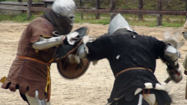 Brave knight challenging rival to fight, two men reenacting medieval tournament