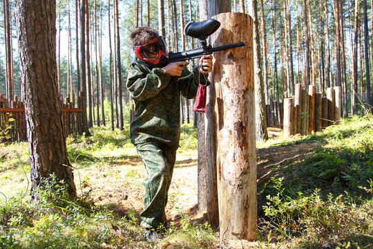 Young man in camouflage uniform on extreme training