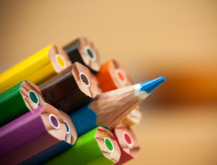 Bunch of color pencils with one of them standing out from the group