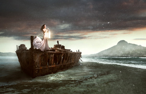 Woman with a lantern on a shipwreck