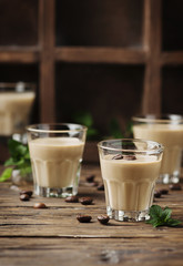Cold cream with coffe and mint on the wooden table