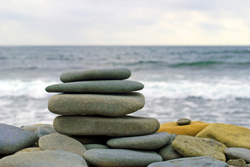 Balanced stones on the sea background