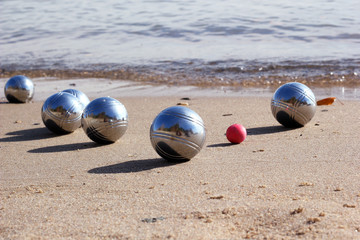 Petanque balls on the sandy beach