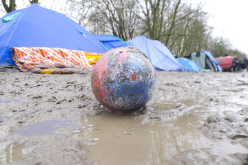 Dunkerque, France-24 January 2016: Refugee camp Grande-Synthe in France is a muddy camp with a lot of dirty waste. People are cold and hungry.