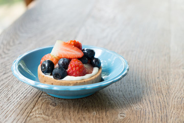 Fresh Berry Tarts on table
