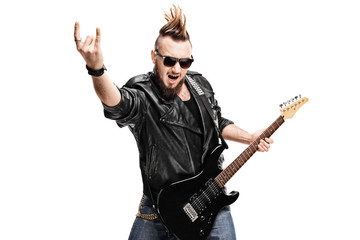 Punk rock guitarist making rock gesture