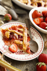 Rustic strawberry and rhubarb lattice pie with ice cream