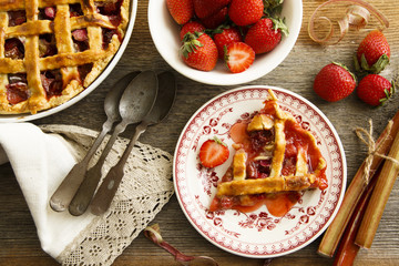 Rustic strawberry and rhubarb lattice pie with ice cream