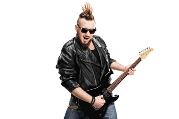 Fototapeta na wymiar Young punk rocker playing electric guitar
