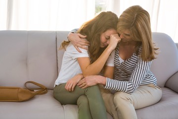 Fototapeta na wymiar Mother comforting her teenage daughter