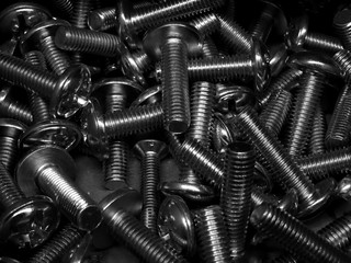 Hardware shop. Screw bolts in box texture background