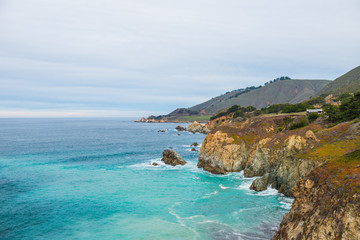 Fototapeta na wymiar Benches facing the coastline in route 1 California , USA