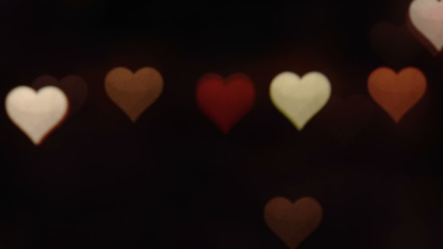 Valentine's day abstract background,flickering hearts and particles.Loopable.