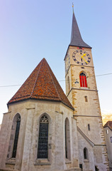 Fototapeta na wymiar Church of St Martin at sunrise in Chur