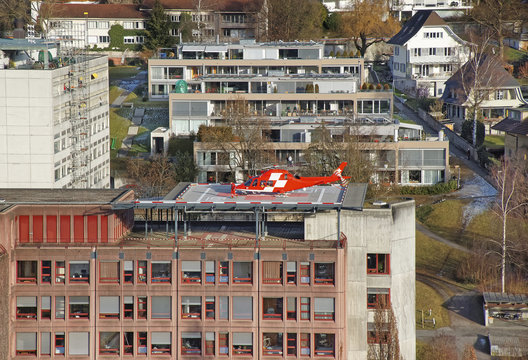 Helicopter Landing On The Hospital Roof In Thun City