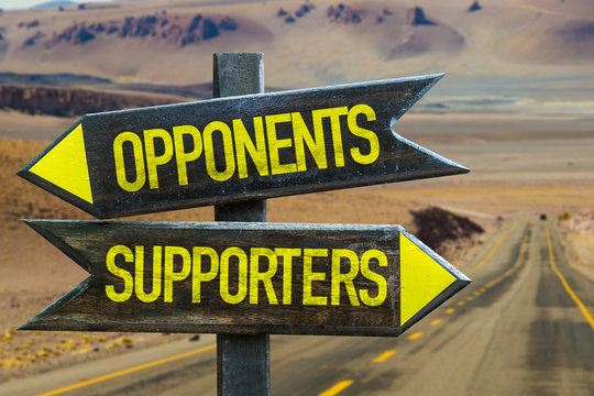 Opponents - Supporters signpost in a desert background