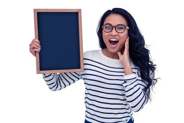 Surprised Asian woman holding blackboard
