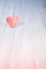 Red heart on wooden background, space for text