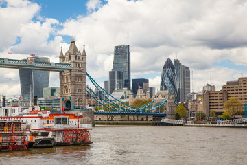 LONDON, UK - APRIL 30, 2015: Tower bridge and City of London financial aria on the background. View includes Gherkin and other buildings