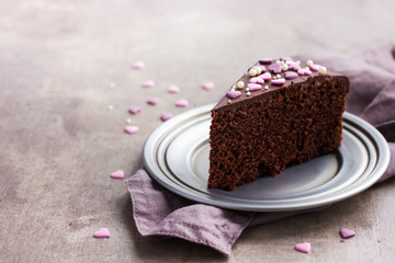 Piece of delicious chocolate cake for romantic dinner