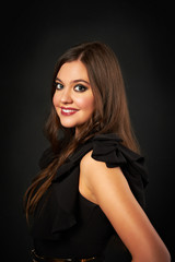 Naklejka premium Portrait of beautiful woman in black dress