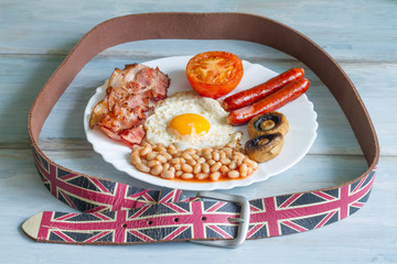 English breakfast diet abstract concept with food and belt
