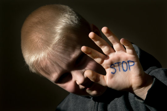 Abused child with stop hand jesture