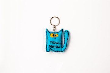 Felt keychain, handmade cat sewn from felt isolated on white background