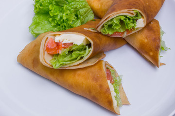 Pancakes (rolls) with salmon