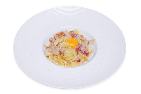 pasta carbonara with parmesan, egg yolk and bacon, isolated, clipping path