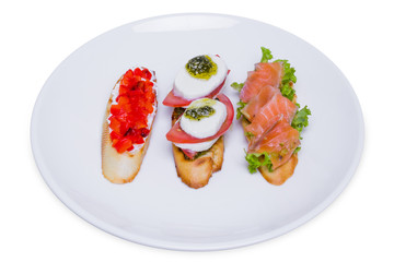 Italian bruschetta set (mini sandwich) with tomato, mozzarella and salmon