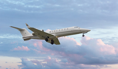 Naklejka na ściany i meble Passenger jet fly over in a cloudy sky