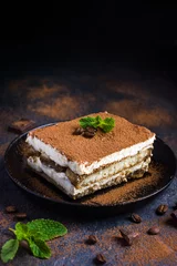 Gartenposter Traditional italian dessert tiramisu on blake plate © anna_shepulova