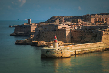 Fototapeta na wymiar The lighthouse in Grand Harbour. Valletta, Malta